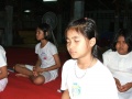 Thai Buddhist child is sitting the concentration happily.jpg