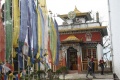 Main Shrine of Pemangytse Gompa with prayer flags.jpg