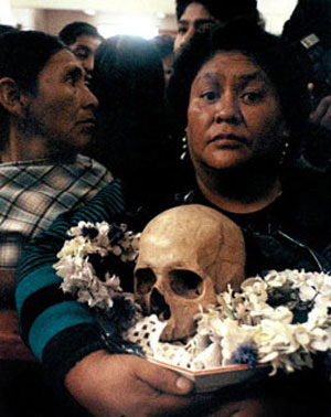 Ancestors' skulls, reverently preserved by their families and each year receiving offerings on All Souls' Day (Bolivia)