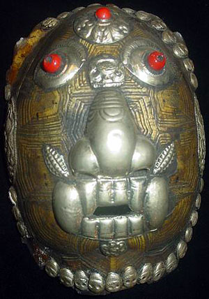 A recent kapala made partly of a turtle shell.
