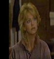 Goldie Hawn (Buddhist) with polo shirt collar up