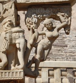 Perhaps the most famous of all śālabhañjikā, supporting a toran beam at the great stupa of Sanchi.