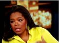 Oprah Winfrey with yellow shirt, collar up
