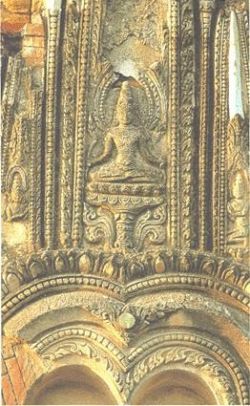 Central figure within the doorway pediment, south face.