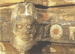 Ogre with green and yellow glazed insets, west.