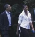 First Lady of the U.S. Michelle Obama with collar up (at back)