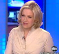 Diane Sawyer, with collars straight up