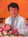 Jackie Chan with blazer coat collar up